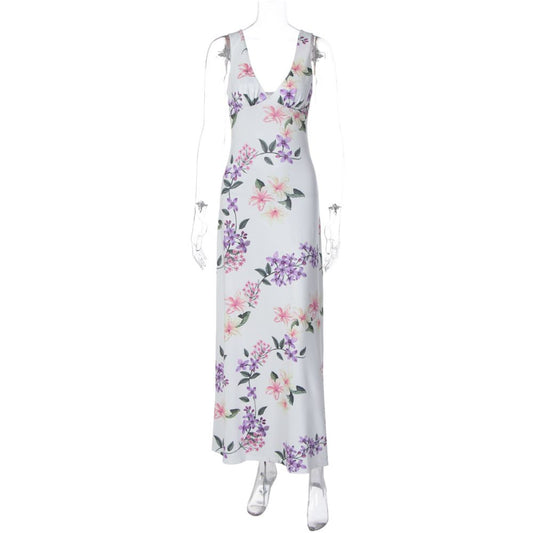 Shemoda French vacation style floral V neck camisole dress with a feminine feel featuring a backless high waisted slim fit and knee length skirt