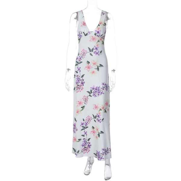Shemoda French vacation style floral V neck camisole dress with a feminine feel featuring a backless high waisted slim fit and knee length skirt